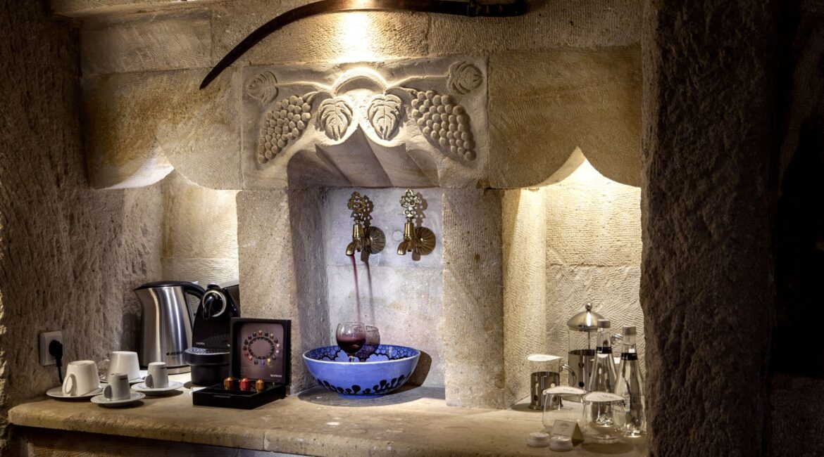 Traditional cave bathroom interiors and wine taps at Museum Hotel Cappadocia