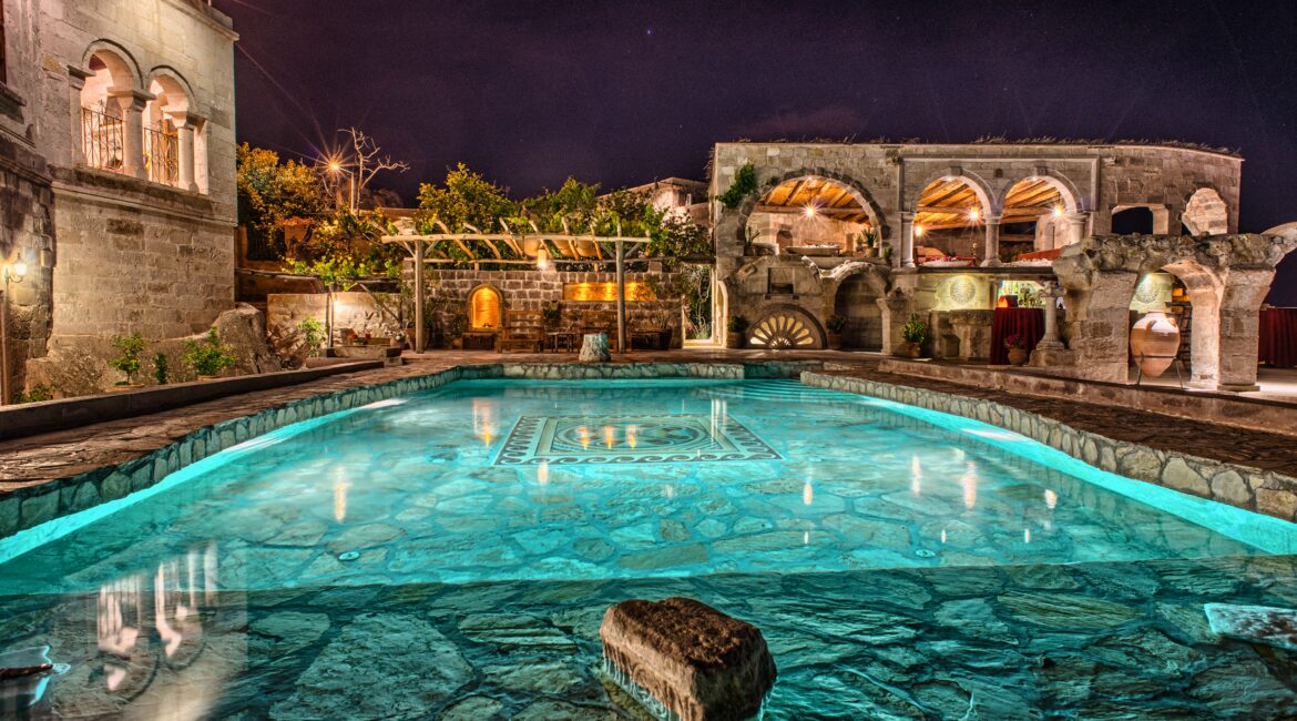 Evening pool terrace at Museum Hotel Cappadocia with panoramic valley views