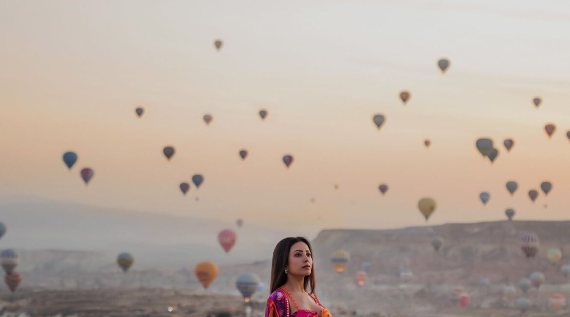 Sunrise poolside views with hot-air balloons at Museum Hotel Cappadocia