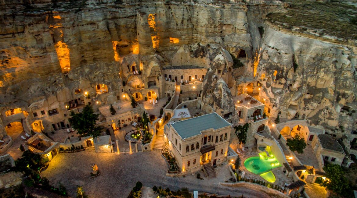 Aerial view of Yunak Evleri illuminated at dusk in Ürgüp, Cappadocia