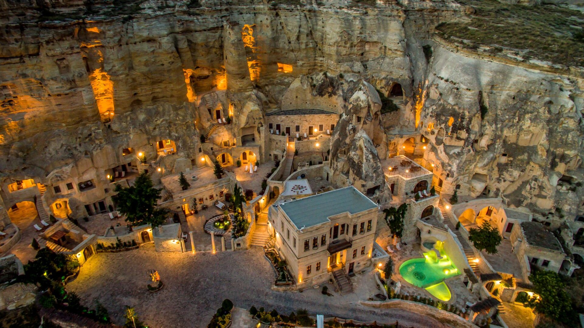Aerial view of Yunak Evleri illuminated at dusk in Ürgüp, Cappadocia