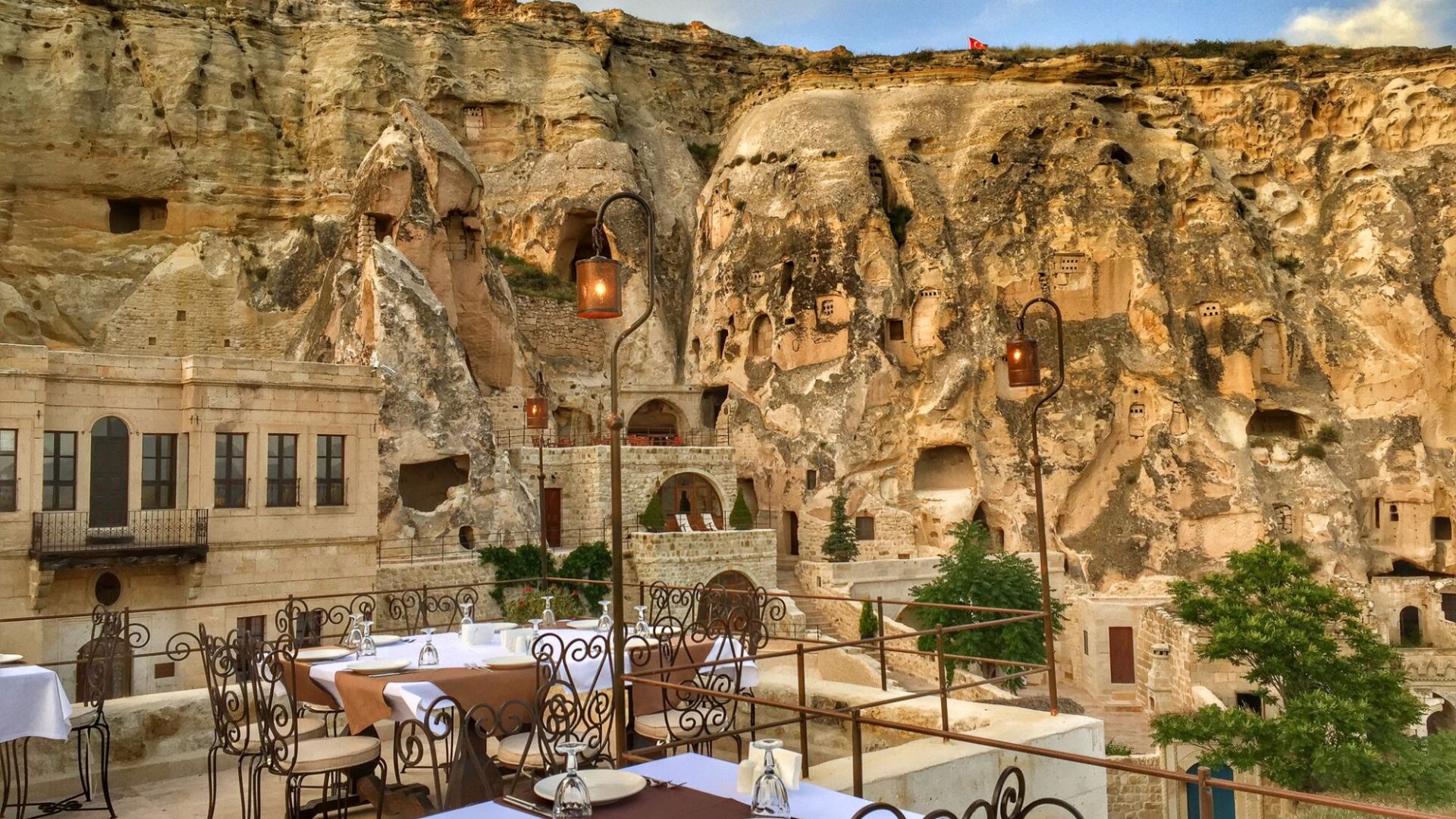 Terrace dining beneath Cappadocia's cave cliffs at Yunak Evleri