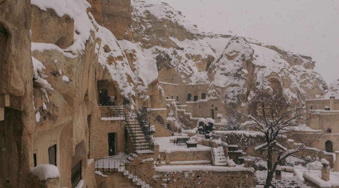 Historic cave hotel architecture at Yunak Evleri in winter