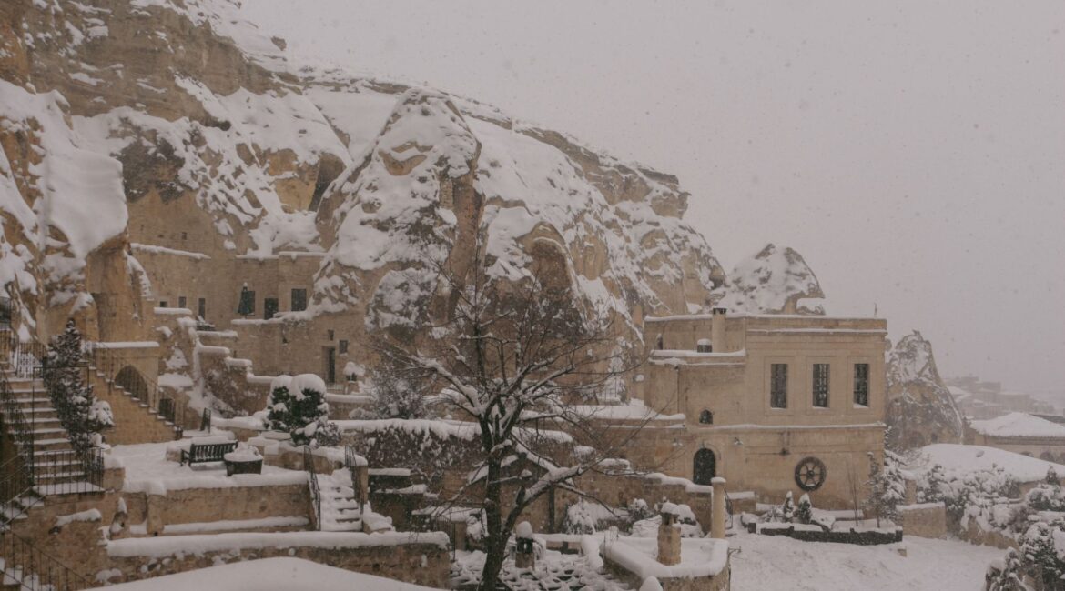 Snow-covered gardens and historic cave dwellings at Yunak Evleri