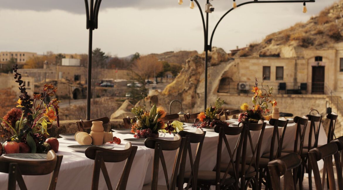 Outdoor restaurant terrace overlooking fairy chimneys in Cappadocia