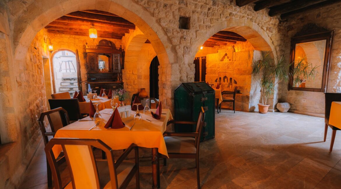 Atmospheric cave restaurant interior at Yunak Evleri Cappadocia