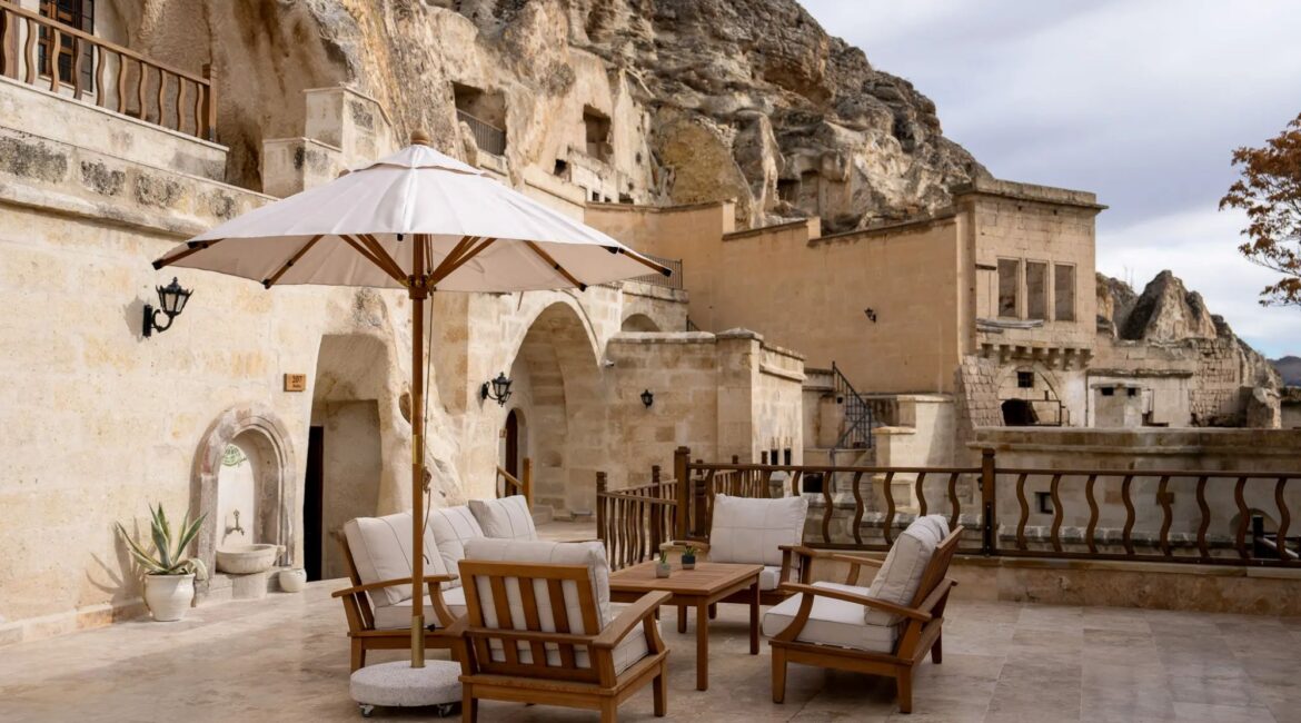 Historic courtyard terrace seating at Asmali Konak Cave Suites, cave hotel in Urgup