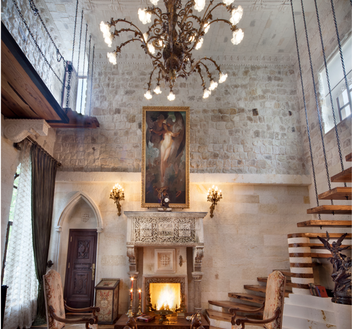 Elegant lounge with chandelier and fireplace at Sacred House Cappadocia
