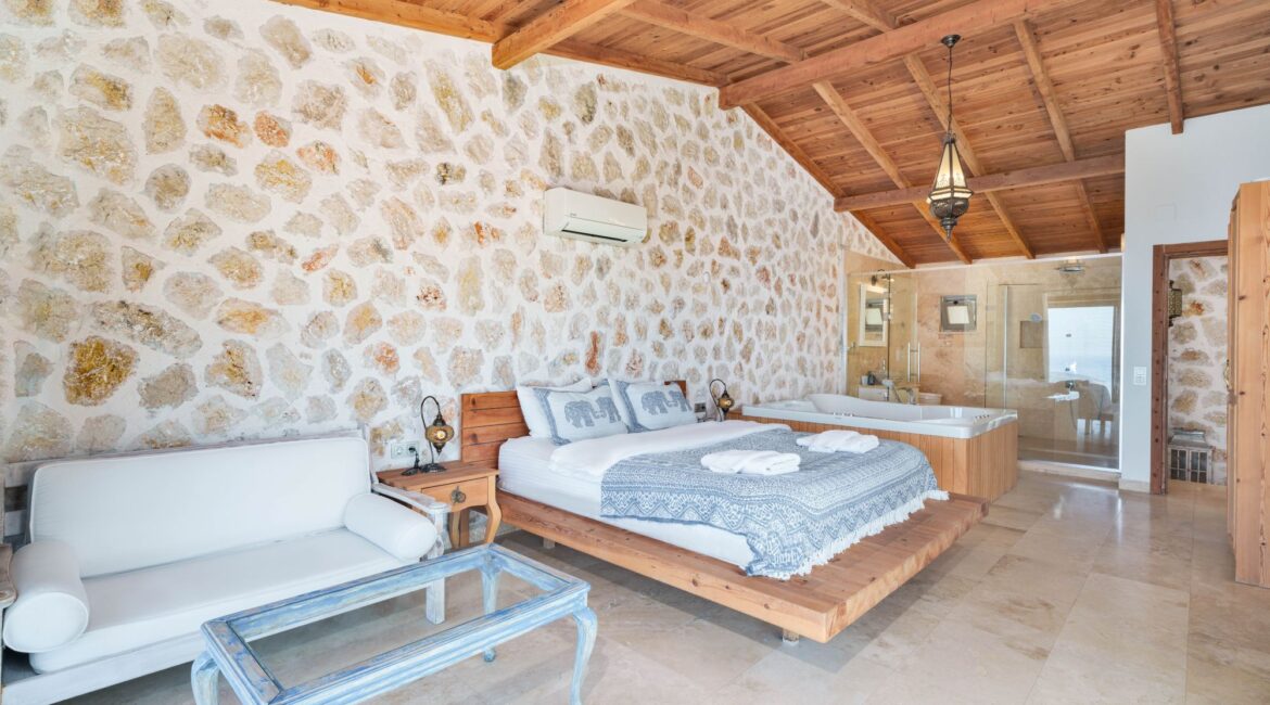 Master bedroom at Villa Sedir Ev with traditional stone interiors