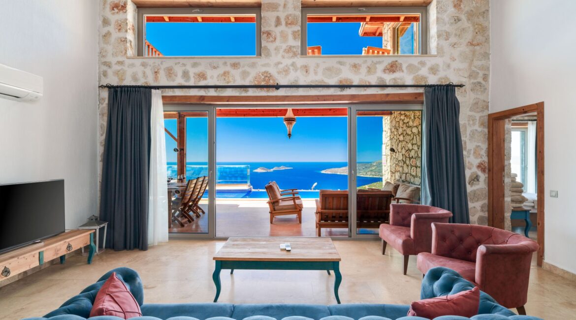 Open-plan living room at Villa Sedir Ev with views across Kalkan Bay