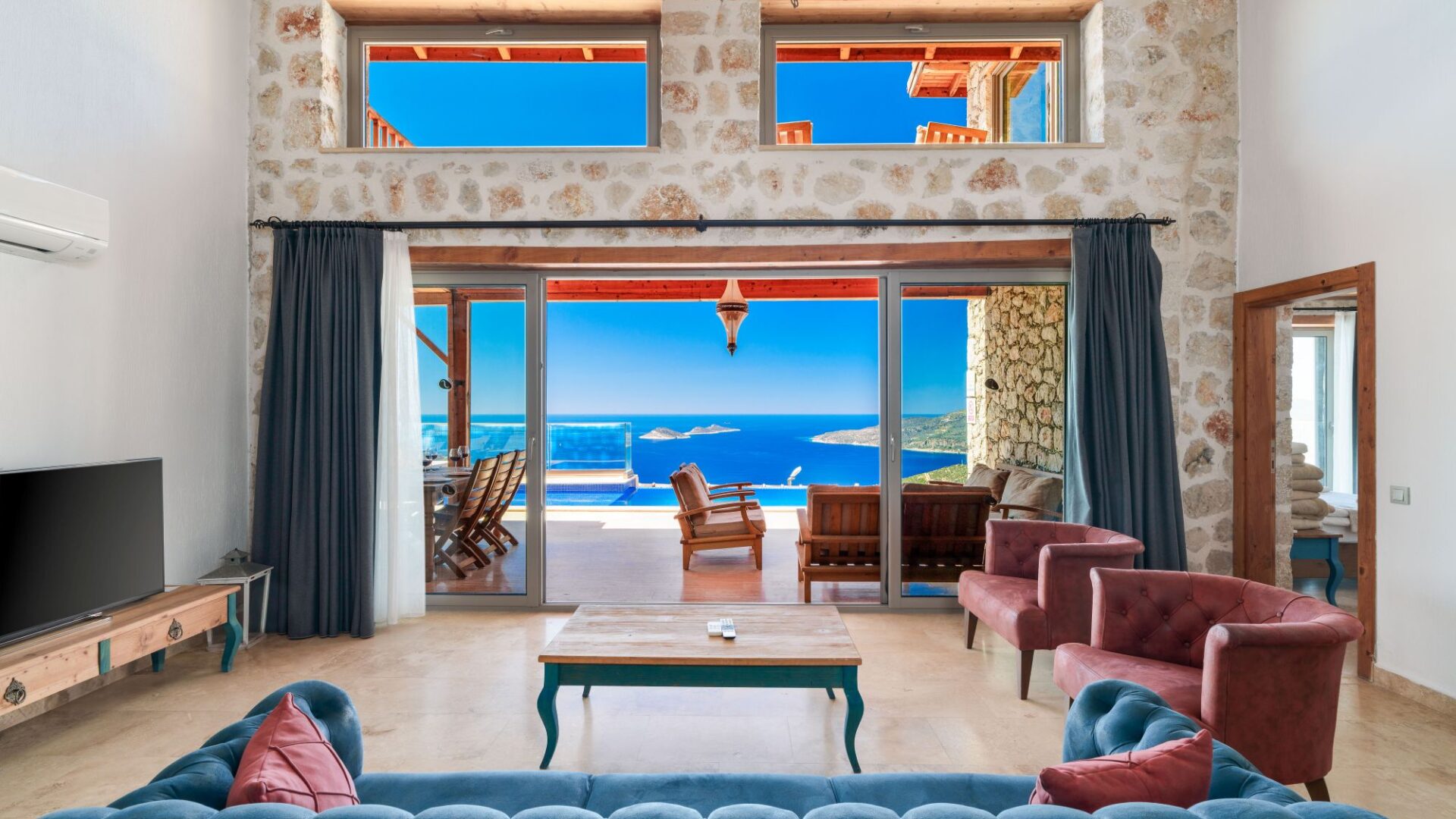 Open-plan living room at Villa Sedir Ev with views across Kalkan Bay