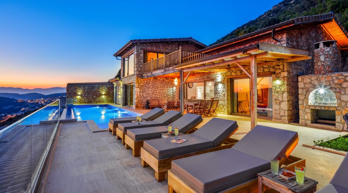 Pool terrace illuminated in the evening at Villa Sedir Ev, Kalkan