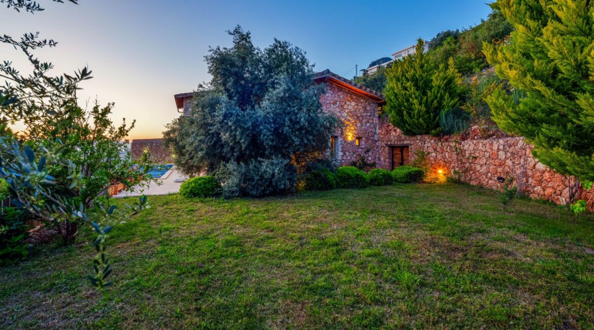Private garden at Villa Sedir Ev surrounded by natural hillside scenery