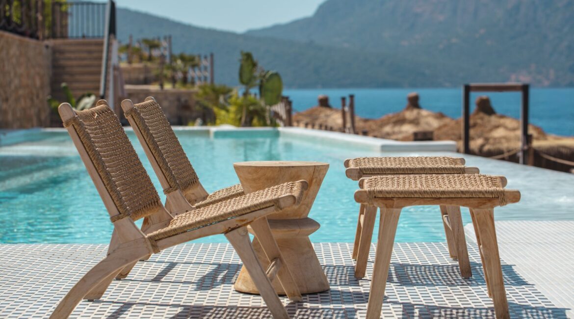 Poolside lazy chairs overlooking the Mediterranean at the Lures Hotel