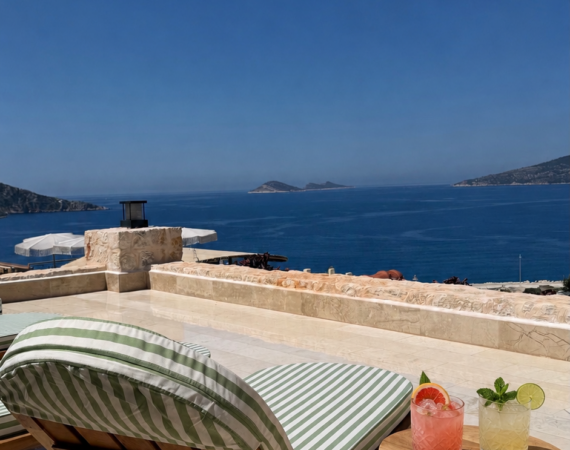 Furnished terrace outside Deluxe Room 15 Thalia at Casa Pery Kalkan overlooking Kalkan Bay.
