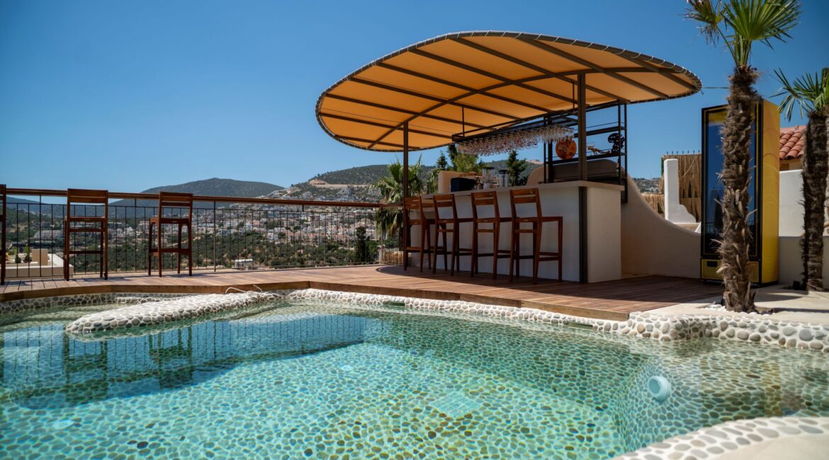 Outdoor swimming pool and pool bar at Casa Pery in Kalkan.