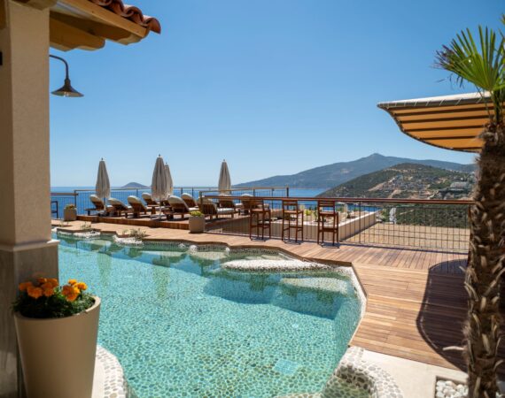Pebble pool and pool terrace at Casa Pery in Kalkan with panoramic sea views.