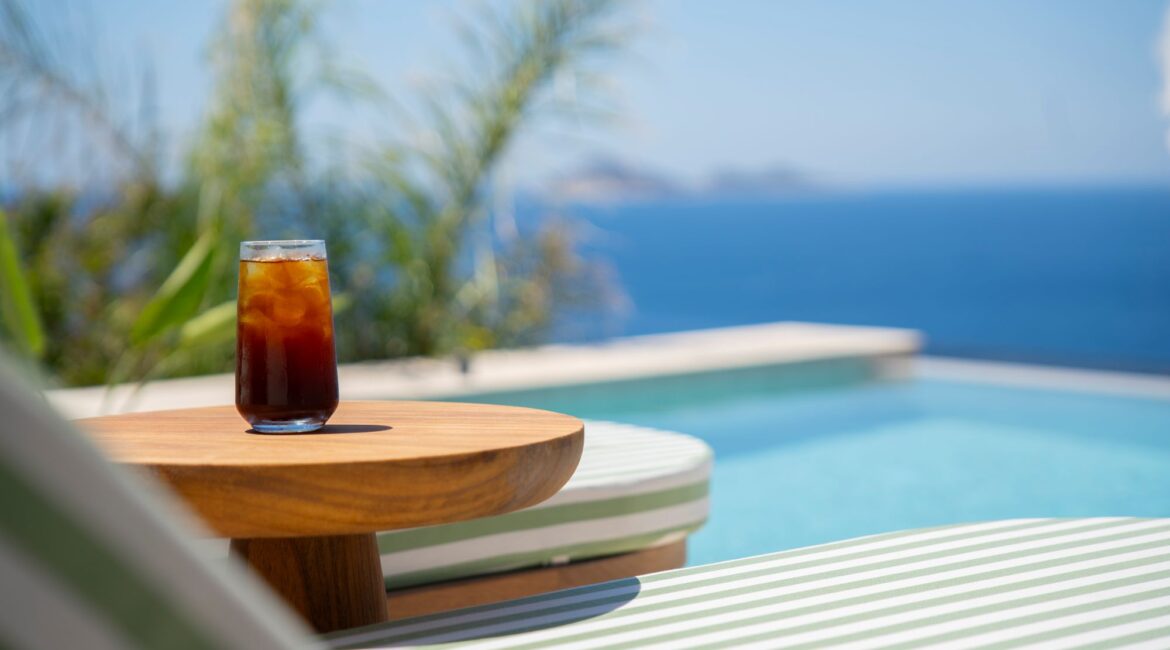 Poolside daybed and refreshments at Casa Pery in Kalkan overlooking the Mediterranean Sea.