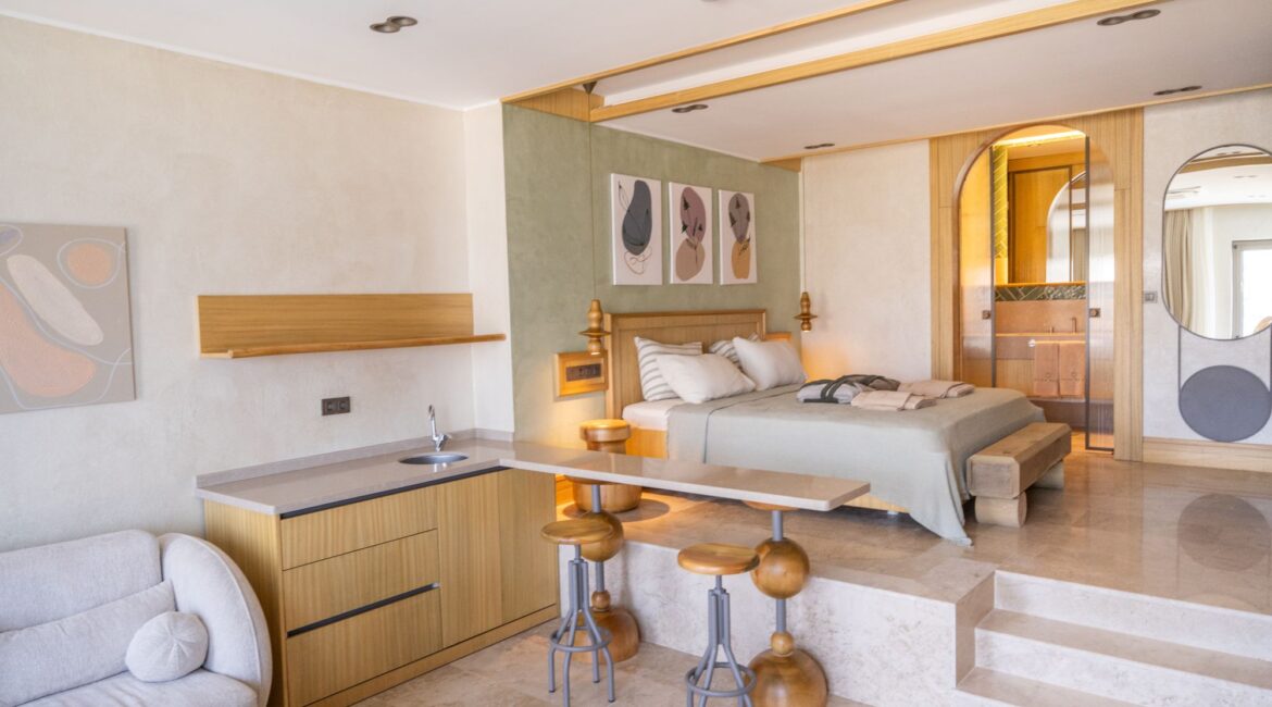 livia-split-level-overview.jpg Split-level Suite Livia (Room 4) at Casa Pery in Kalkan featuring the bedroom, sitting area and contemporary Mediterranean interiors.