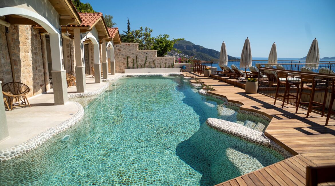 Swim-up room terraces overlooking the pebble pool at Casa Pery in Kalkan.