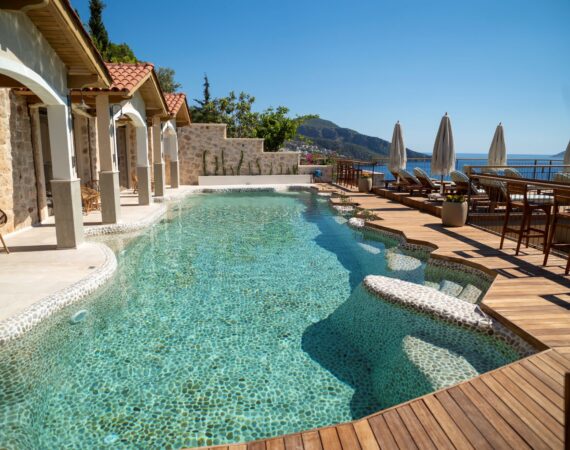 Swim-up room terraces overlooking the pebble pool at Casa Pery in Kalkan.