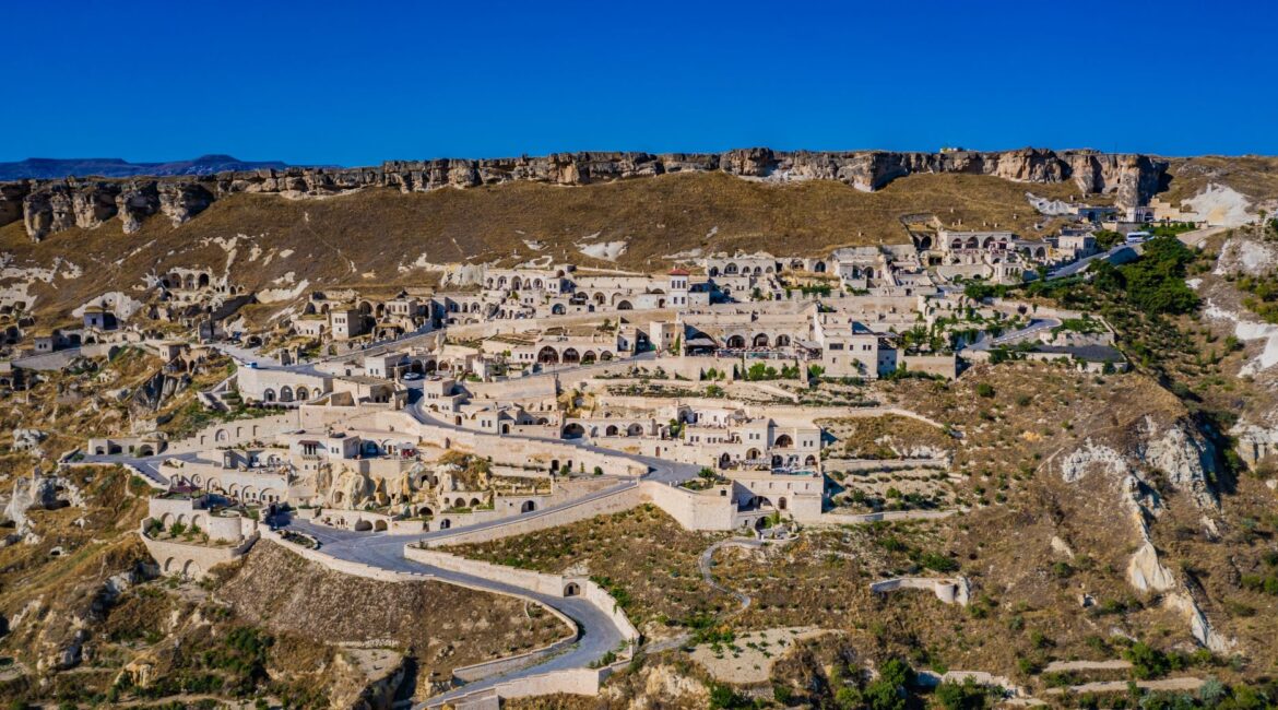 Aerial view of Kayakapı Premium Caves and the historic hillside of Ürgüp, Cappadocia