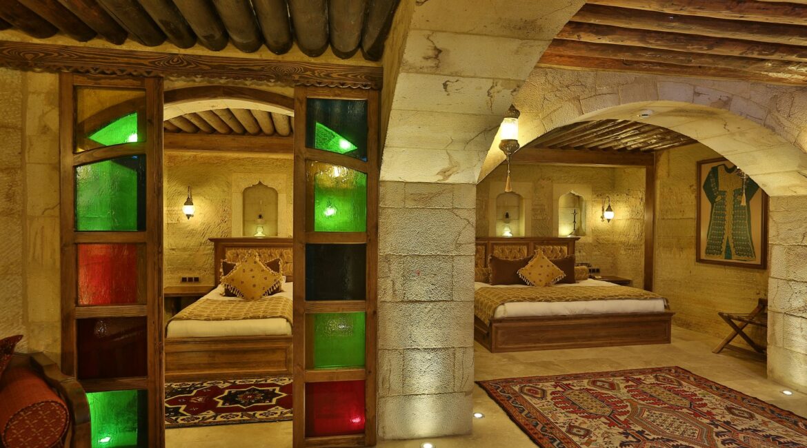 Beautifully restored historic cave suite at Kayakapı Premium Caves, Cappadocia featuring authentic stone architecture and luxurious interiors.