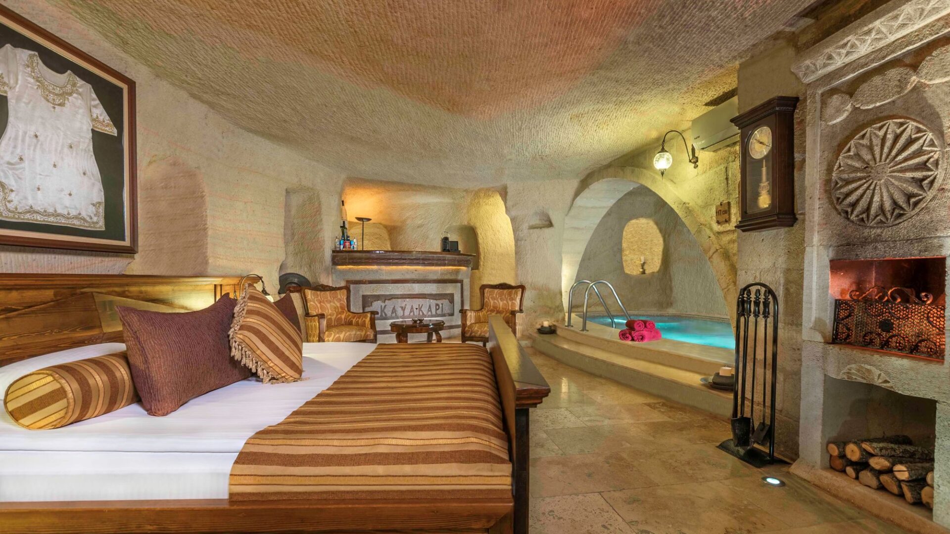 Luxury cave suite bedroom at Kayakapı Premium Caves, Cappadocia