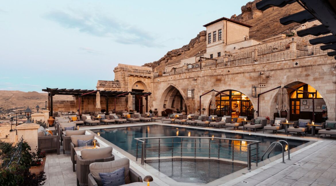 Outdoor swimming pool and terrace at Kayakapı Premium Caves, Cappadocia