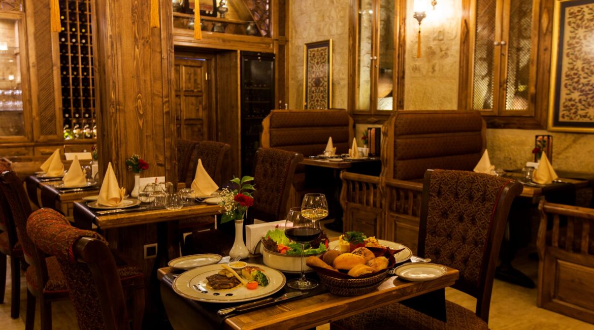 Elegant restaurant at Kayakapı Premium Caves serving Turkish and international cuisine