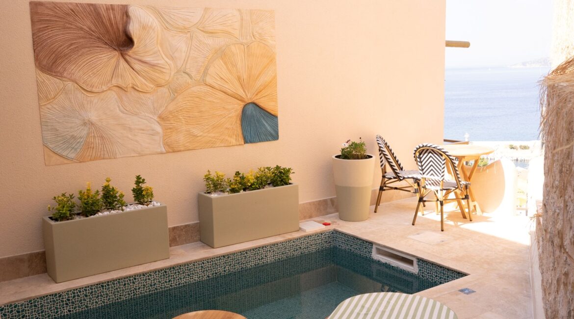 Pool terrace at Pool Room 5 Begonia, Casa Pery Hotel, Kalkan with contemporary outdoor seating and sunbathing area.