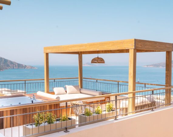Outdoor jacuzzi and private sun terrace at Premium Room 8 Perivana, Casa Pery Hotel, Kalkan with panoramic views across Kalkan Bay.