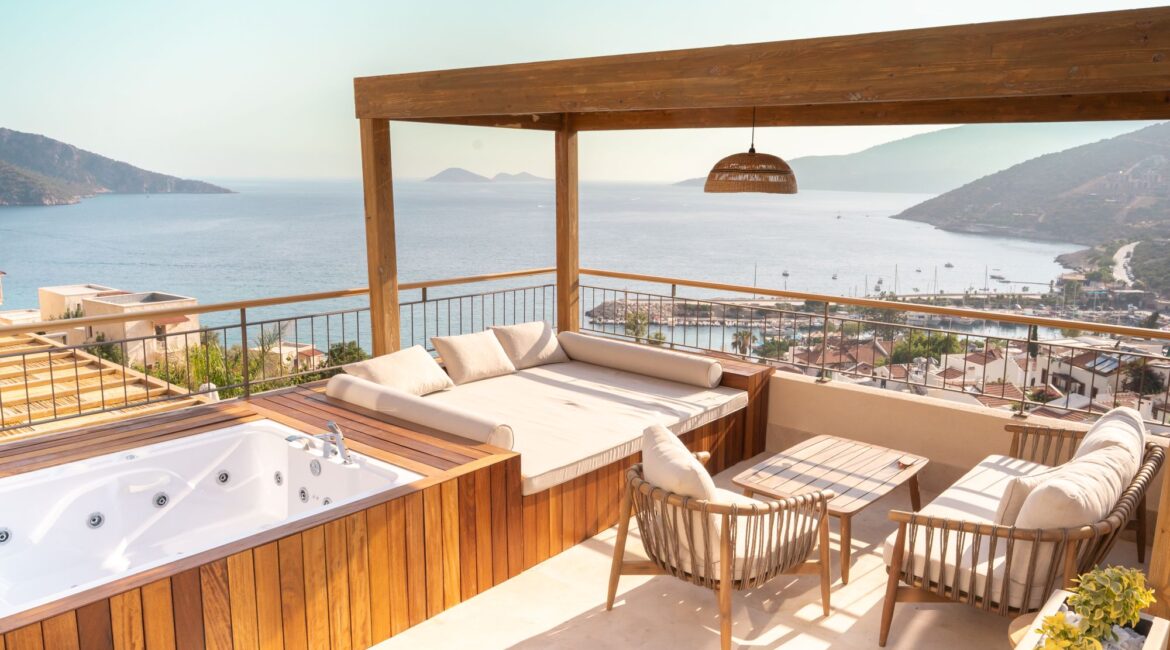 Private sea-view terrace with outdoor jacuzzi at Premium Room 8 Perivana, Casa Pery Hotel in Kalkan overlooking Kalkan Bay.