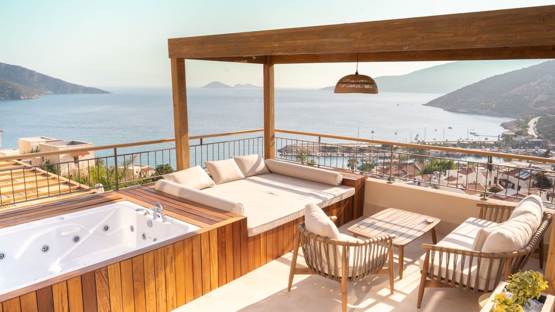 Private sea-view terrace with outdoor jacuzzi at Premium Room 8 Perivana, Casa Pery Hotel in Kalkan overlooking Kalkan Bay.