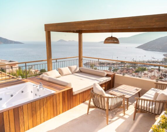 Private sea-view terrace with outdoor jacuzzi at Premium Room 8 Perivana, Casa Pery Hotel in Kalkan overlooking Kalkan Bay.