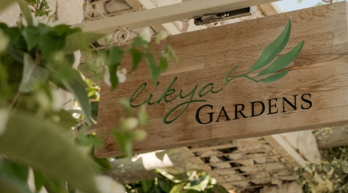 Entrance sign surrounded by Mediterranean planting at Likya Gardens boutique hotel in Kalkan, Turkey.