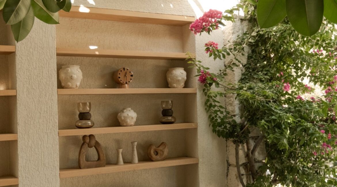 Elegant outdoor reception lounge surrounded by mature gardens at Likya Gardens boutique hotel in Kalkan, Turkey.