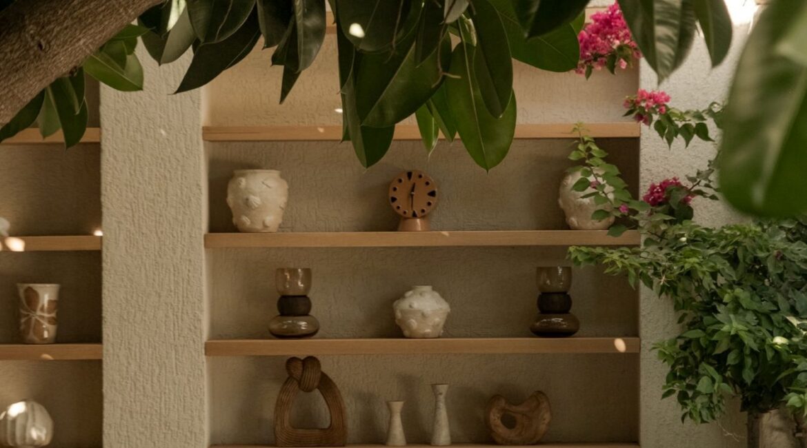 Stylish reception lounge with natural stone architecture and garden surroundings at Likya Gardens boutique hotel in Kalkan, Turkey.