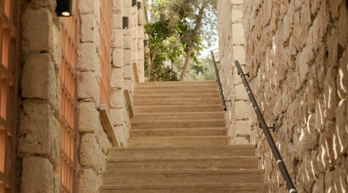 Traditional stone staircase leading through the peaceful courtyard at Likya Gardens boutique hotel in Kalkan.