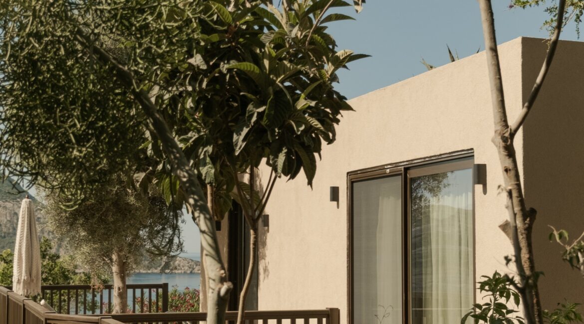 Exterior of a Comfort Suite at Likya Gardens boutique hotel in Kalkan, surrounded by Mediterranean gardens.