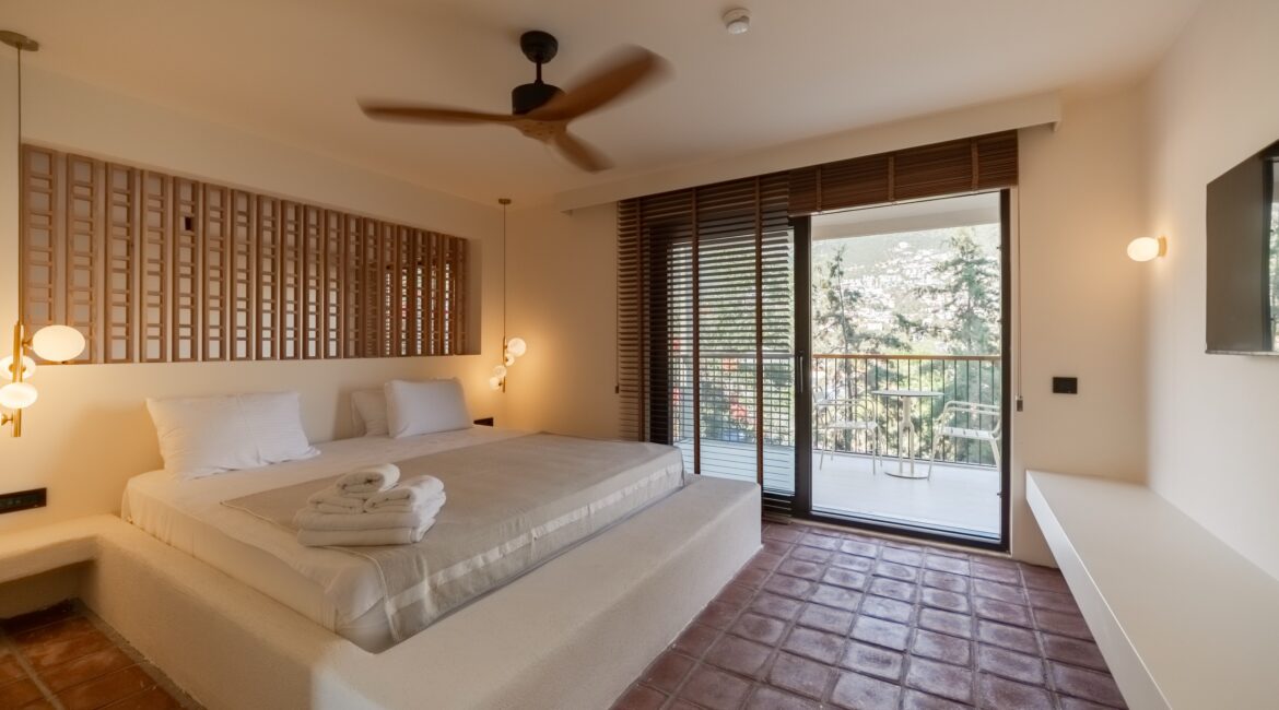 Bright Comfort Suite bedroom with balcony at Likya Gardens boutique hotel in Kalkan.