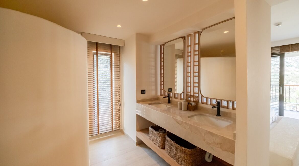 Double vanity bathroom in a Comfort Suite at Likya Gardens boutique hotel.