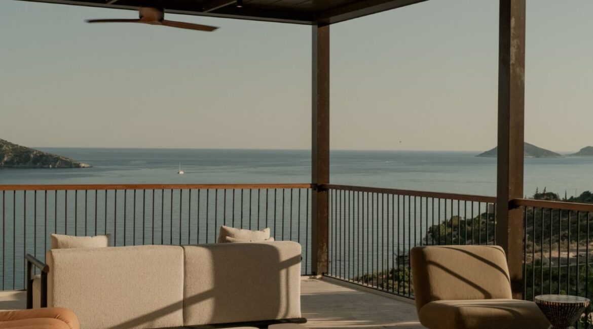 Covered rooftop terrace with panoramic sea views at Asfiya Sea View boutique hotel.