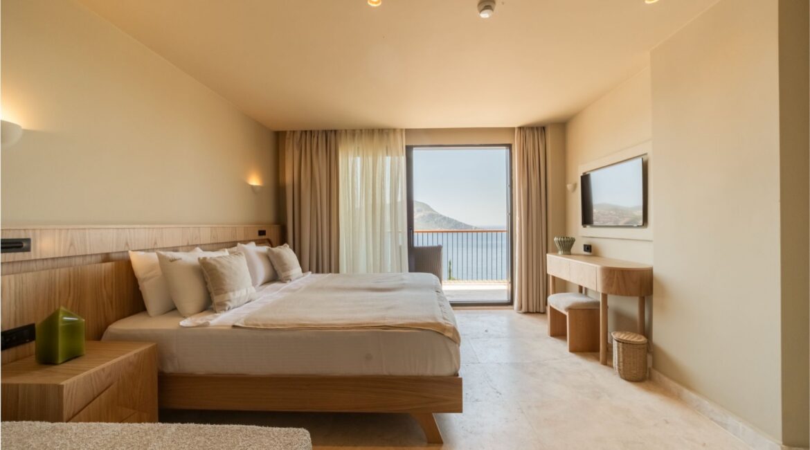 Spacious Sea View Room with king-size bed and private balcony at Asfiya Sea View boutique hotel.