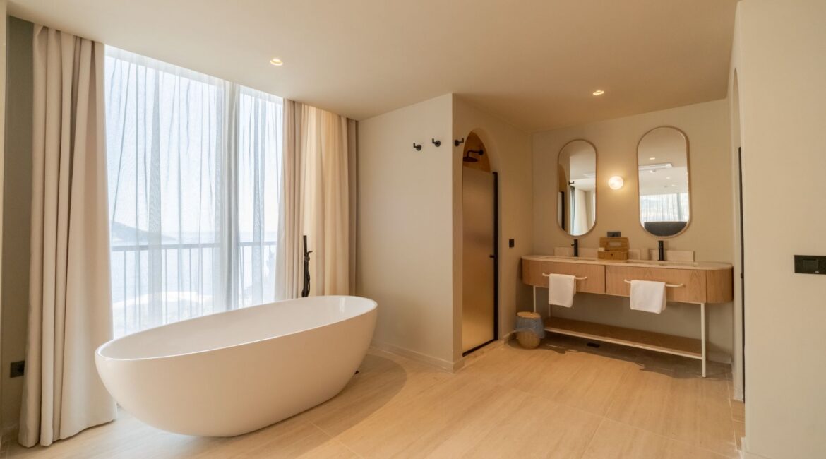 Luxury Signature Pool Room with freestanding bath and stylish open-plan design at Asfiya Sea View overlook