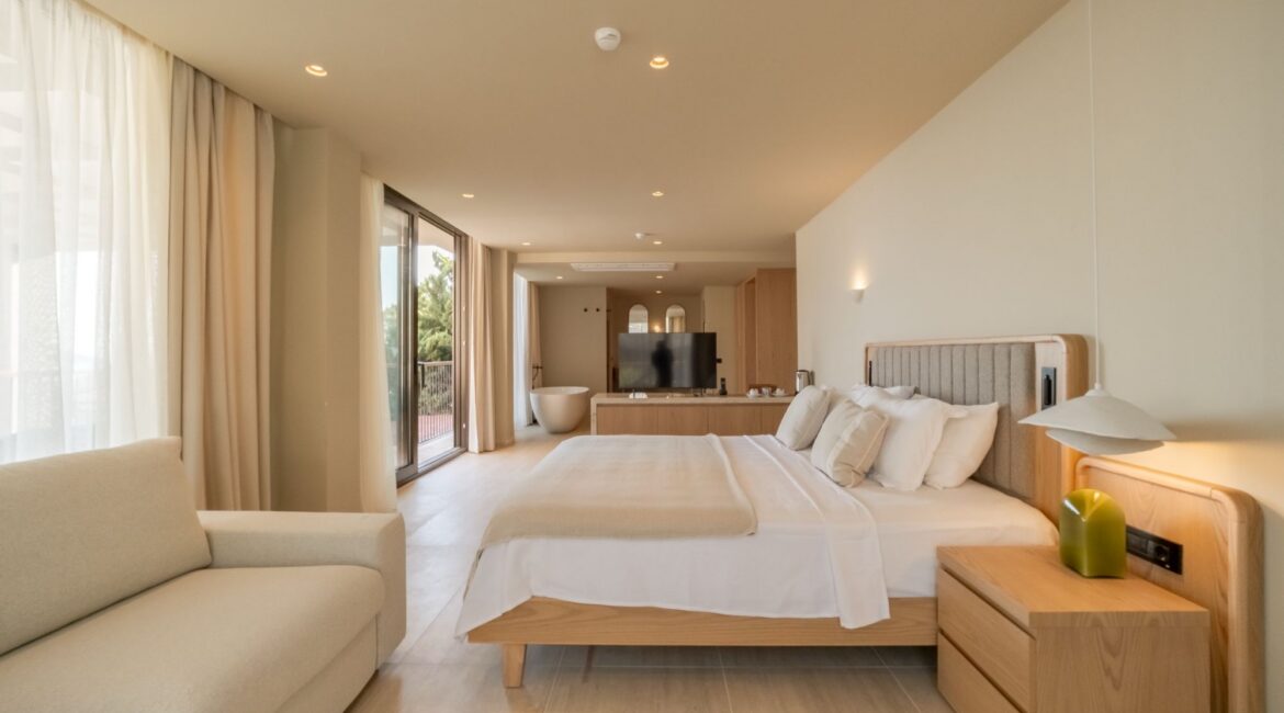Signature Pool Room at Asfiya Sea View in Kalkan, featuring a spacious bedroom with contemporary furniture