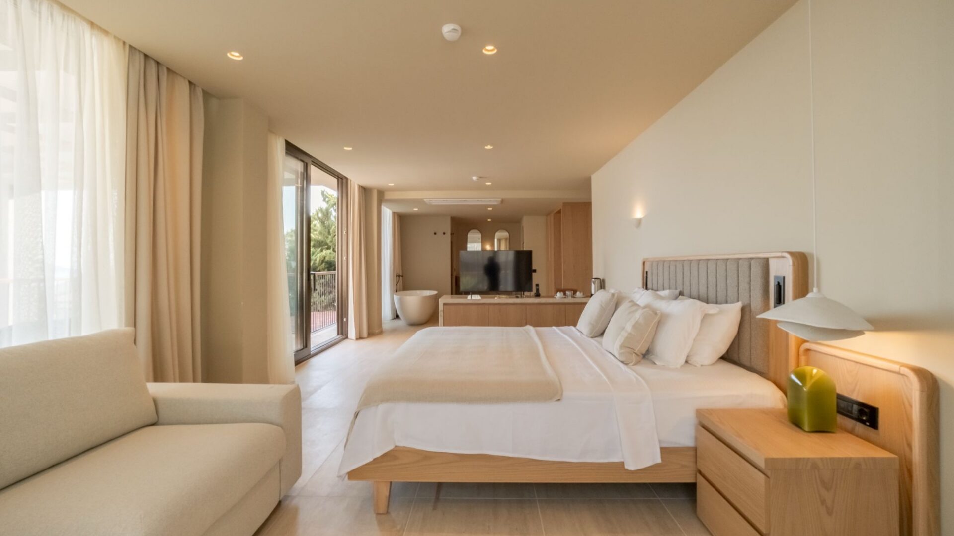 Signature Pool Room at Asfiya Sea View in Kalkan, featuring a spacious bedroom with contemporary furniture