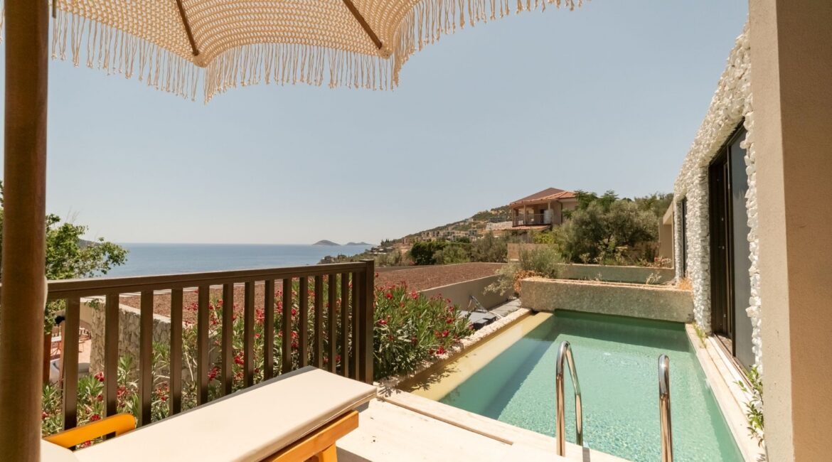 Private pool and sun terrace outside a Premium Pool Room at Asfiya Sea View overlooking Kalkan.