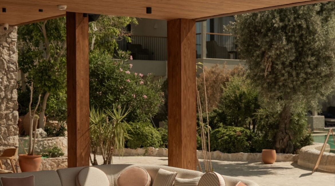 Elegant open-air lounge beside the restaurant terrace at Asfiya Sea View boutique hotel in Kalkan, Turkey.