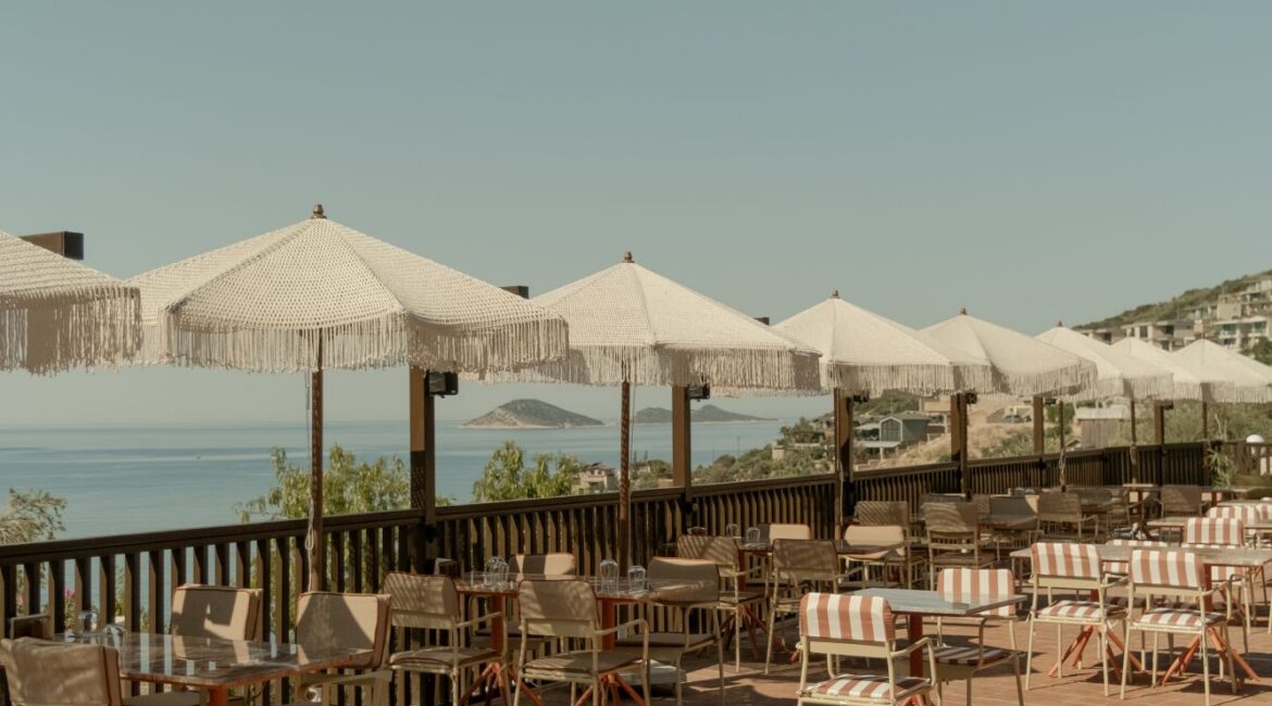 Outdoor restaurant terrace overlooking Kalkan Bay at Asfiya Sea View boutique hotel in Kalkan, Turkey.